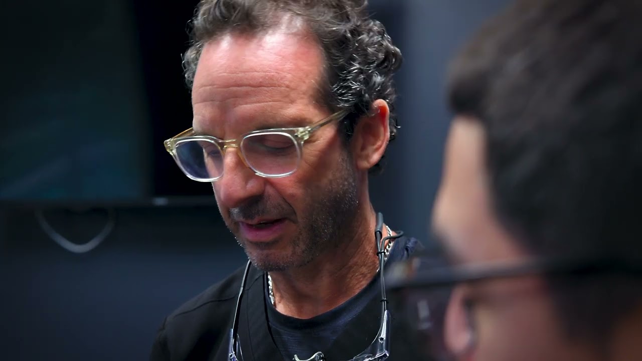 Dr. Friedberg explaining permanent teeth instead of dentures treatment