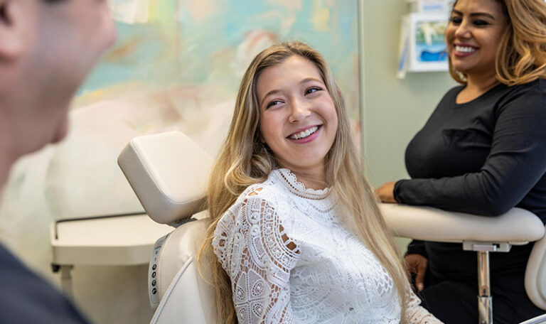 Smiling dental patient during consultation at Dr. Friedberg & Associates in Houston