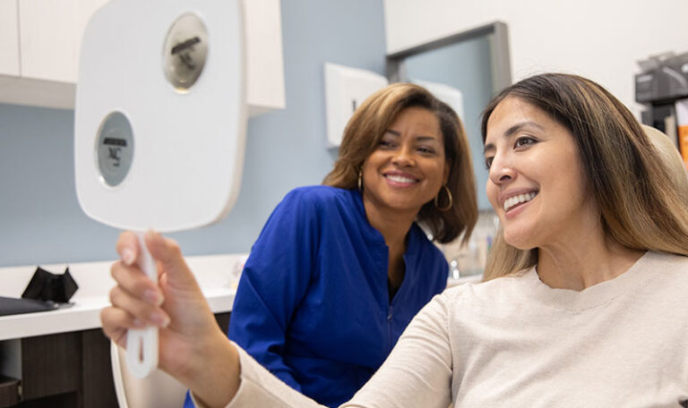 Dental implants Houston periodontist with patient during consultation