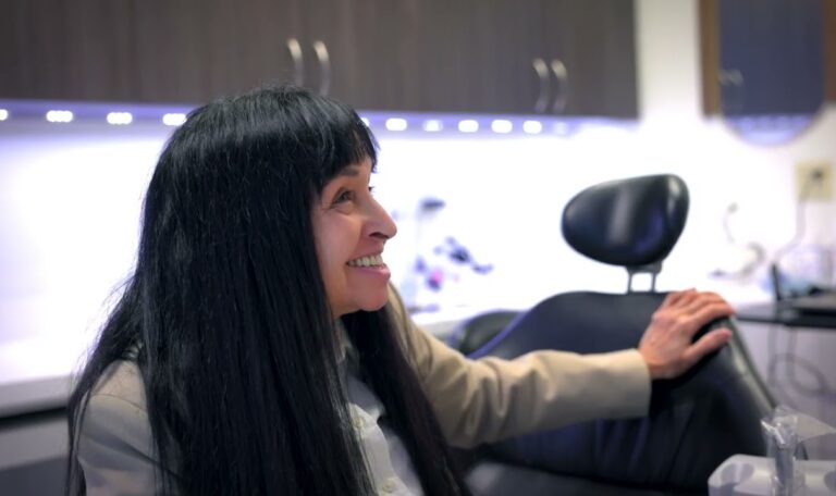 Patient learning about dental implant benefits during a consultation