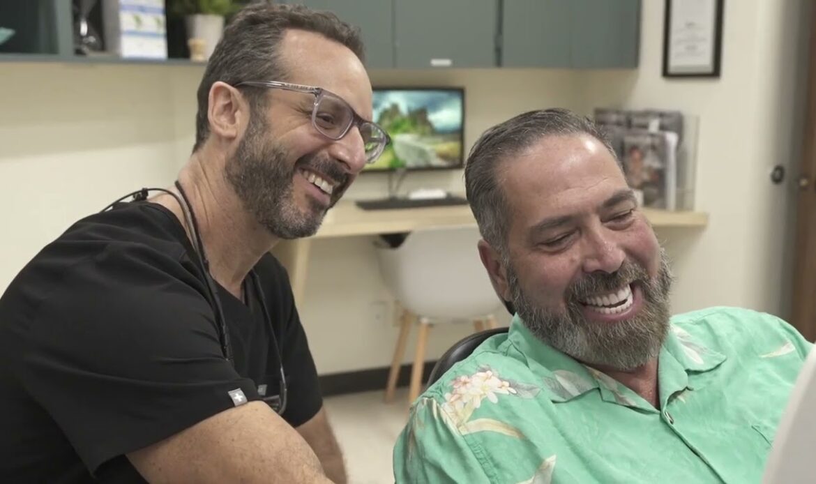 Dental implant consultation in Houston with periodontist and patient