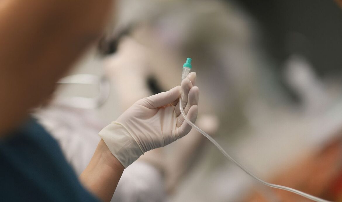 dentist performing IV sedation in Houston dental office