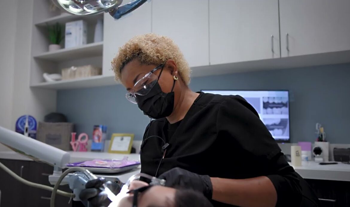 IV sedation dentistry in Houston TX — clinician gently preparing a patient for safe, comfortable dental care at Dr. Friedberg & Associates.