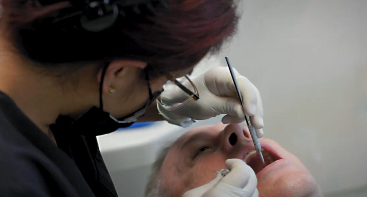 IV sedation dentistry in Houston TX — dentist performing a gentle procedure to help the patient stay calm and comfortable at Dr. Friedberg & Associates.