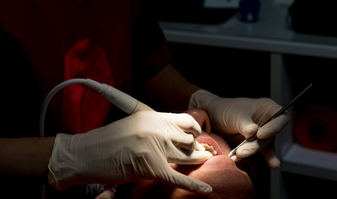 January dental cleaning Houston dentist performing professional teeth cleaning