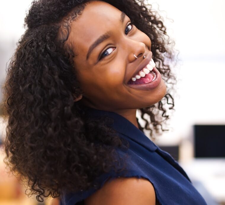 Patient smiling after receiving the best dental implants in Houston