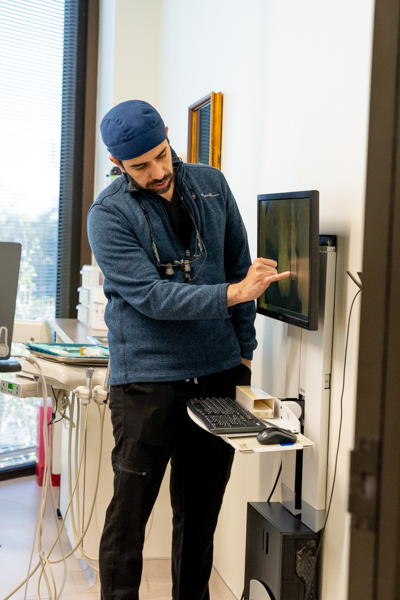 Dentist explaining sinus lift surgery planning before dental implants