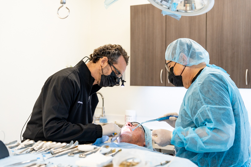 Dental implant candidacy evaluation during implant surgery planning