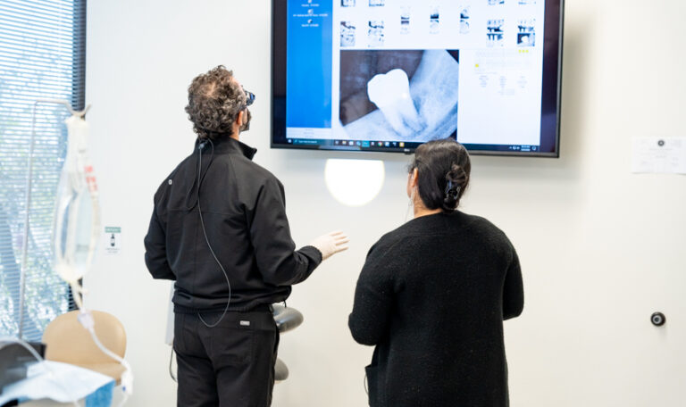 Dr. Friedberg discussing dental implants with bone loss during a patient consultation