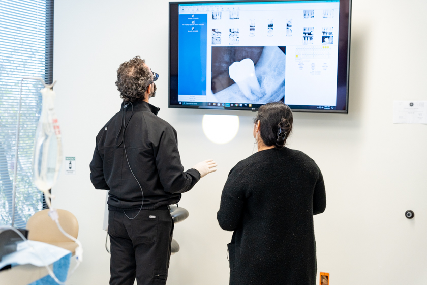 Dr. Friedberg discussing dental implants with bone loss during a patient consultation