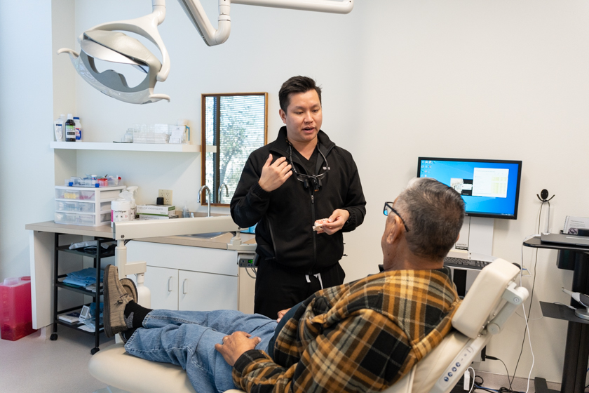Dental implant candidacy consultation with a periodontist discussing treatment options