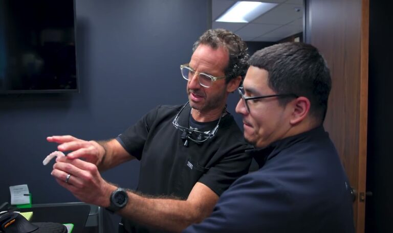 Houston dentist explaining single tooth implant treatment options to a patient