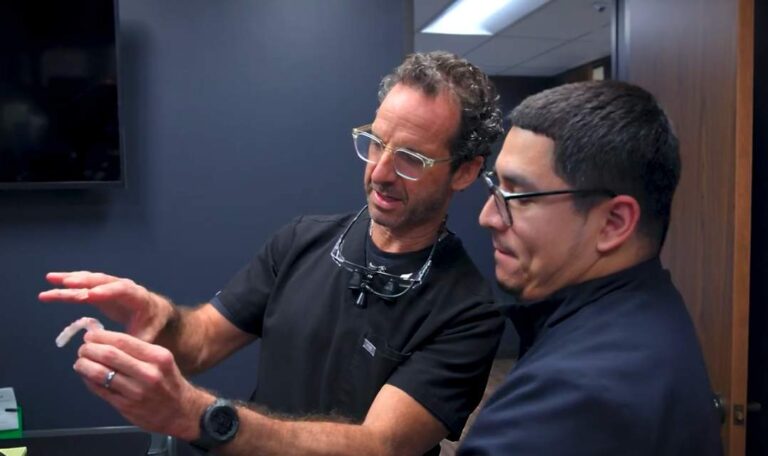 Dental implant specialist discussing treatment options with a patient